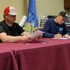 KWC3EMS Chairman John Vaughn and board member Mike Montgomery sign the contract to bring ambulance back to the area.