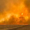 The sky lit up Sunday evening as the gusty south wind pushed smoke and flames north along SH 54 between Roosevelt and Snyder.